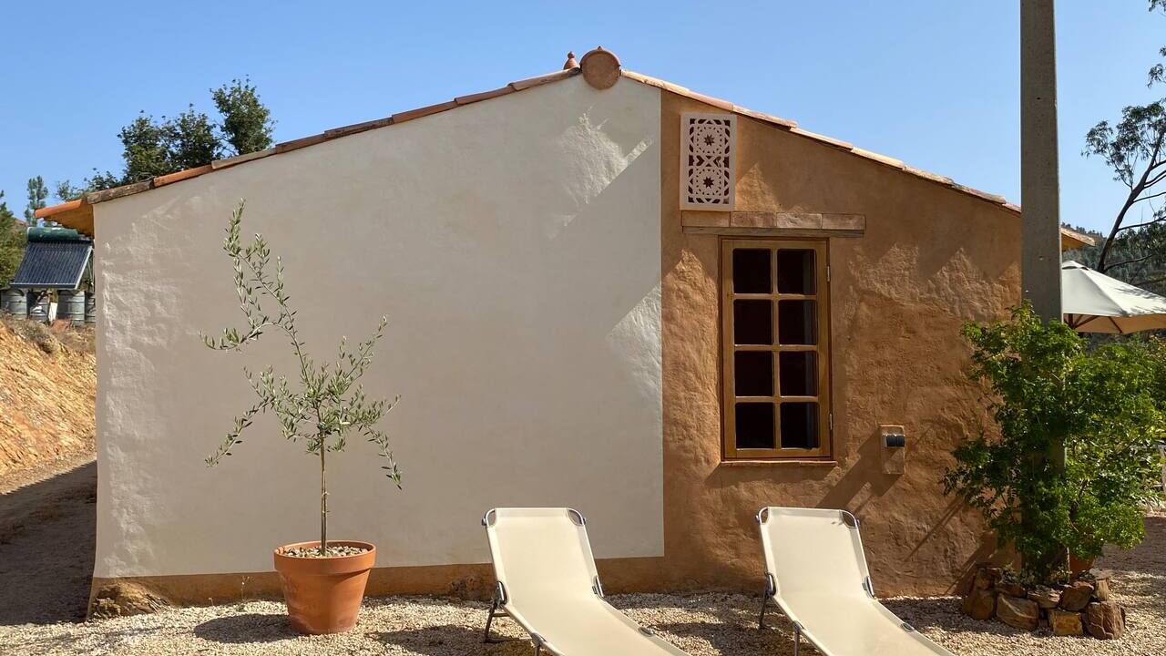 House exterior with sun loungers